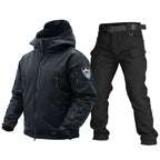 Black tactical jacket and pants set on a white background